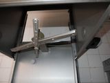 a close up of a metal door with a latch on it