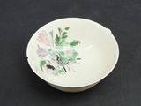 a white bowl with a floral design on it