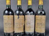 three bottles of wine sitting next to each other on top of a table