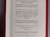 the back of a book with a red border and a black and white image