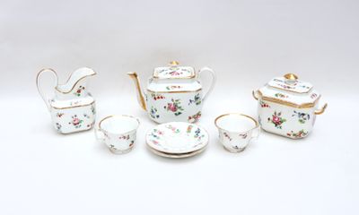 five pieces of porcelain tea and coffee set on a table