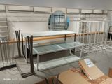 a room with shelves and a mirror in it