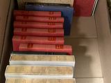 a lot of books in a box on the floor