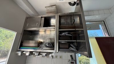 a kitchen with stainless steel cabinets and a window