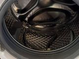 a washing machine that is sitting on the floor