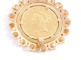 an image of a gold coin pendant with a woman ' s face on it