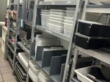a lot of shelves in the kitchen with dishes on them