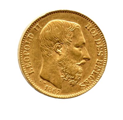 l'image d'une pièce d'or sur laquelle figure le visage d'un homme