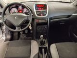 a dashboard of a small car with a clock on the dash