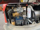 a truck with a bunch of hoses in the back of it