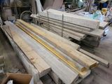 several pieces of wood are stacked on top of each other in a warehouse