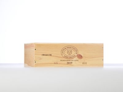 a close up of a wooden box on a table with a white background