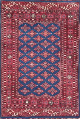 a blue and red rug with a diamond design