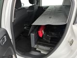 a car that has a surfboard in the back of it