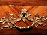 a metal handle on a wooden door handle