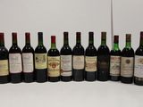 several bottles of wine are lined up in a row on a table