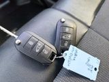 a picture of a car key with a price tag attached to it
