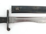 two knives that are laying side by side on a white surface
