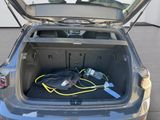 a trunk of a car with a bag in the trunk