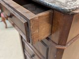 a close up of a drawer with a marble top