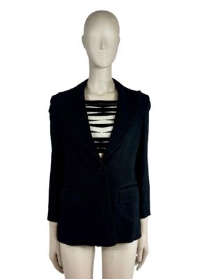 the mannequin is wearing a black blazer and striped top