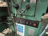 an image of a machine that is working on a piece of wood