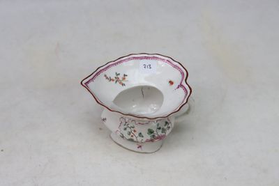 a small white bowl with a floral design on it