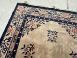 a rug on the floor with a cat laying on it