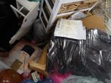 a pile of assorted items in a cluttered room
