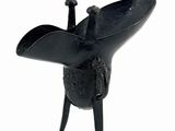 a black sculpture of a bird on a white background