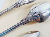 two spoons and two spoons on a plate