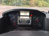 a dashboard of a vehicle with a digital display on it