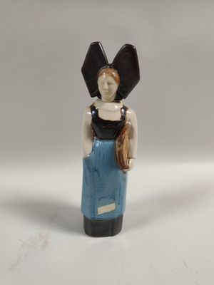 a figurine of a woman in a blue dress