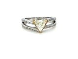a close up of a diamond ring on a white background