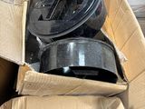a cardboard box with a couple of pots in it