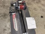 a machine that is sitting on the ground in the garage