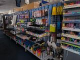 many pens and markers on the shelves in the store