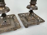 two candles that are sitting on a table