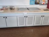 a kitchen with a sink and cabinets in it