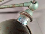 a close up of a metal object with a sticker on it