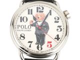a close up of a watch with a teddy bear on it