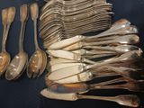 a lot of silver spoons and spoon spoons on a table