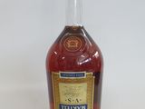 an image of a bottle of liquor sitting on top of a table