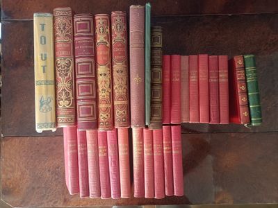 a lot of books that are sitting on a table