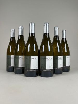 six bottles of wine are lined up in a row on a table