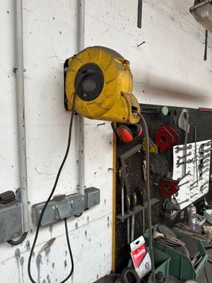 an image of a garage with tools on the wall