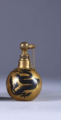 an image of a gold and black vase with a dragon on it