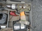 a tool box with tools in it sitting on the ground