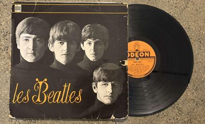 an old record with a picture of the beatles on it
