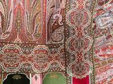 a red and green paisley pattern on a red and green blanket